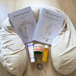 Essentiels du premier trimestre de grossesse - coussin, crèmes, dossier et journal